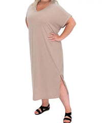 Beige ladies plain maxi dress with side slit, styled with black sandals