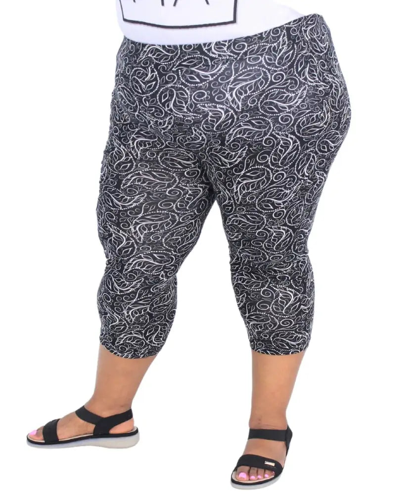 Ladies printed capri leggings featuring a stylish swirly black and white design