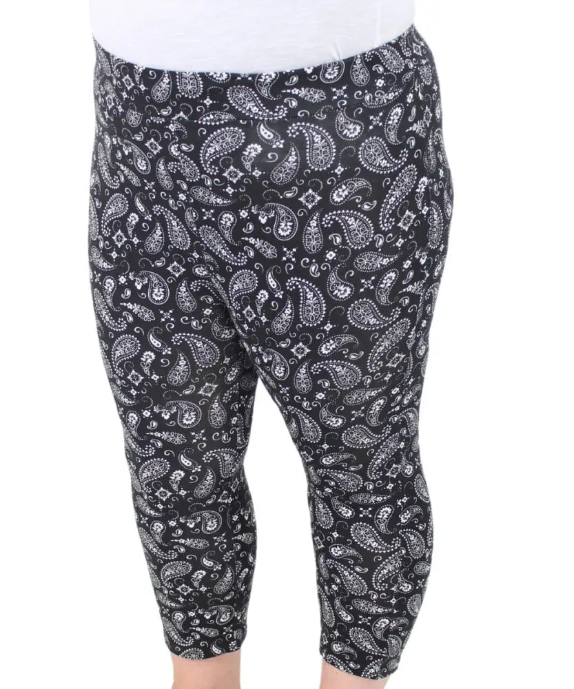 Cropped ladies printed leggings featuring a stylish black and white paisley pattern