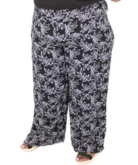 Flowy wide leg palazzo pants featuring a black and white floral print design